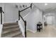 Carpeted staircase with white railings and dark wood accents leading to the second floor at 1236 Ketzal Dr, Trinity, FL 34655