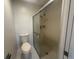 Bathroom featuring toilet and updated glass shower at 12539 Dearborn Dr # A, Hudson, FL 34667