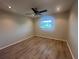 Bedroom featuring vinyl floors and window at 12539 Dearborn Dr # A, Hudson, FL 34667