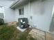 Efficiently sized air conditioning unit nestled outside the home, surrounded by stone pavers and lush greenery at 12539 Dearborn Dr # A, Hudson, FL 34667