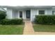Inviting home with a walkway leading to the front door and landscaped yard at 12539 Dearborn Dr # A, Hudson, FL 34667