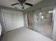 Florida room features sliding glass doors and storage at 12539 Dearborn Dr # A, Hudson, FL 34667