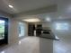 Open-concept kitchen with modern appliances, and an eat-in bar area at 12539 Dearborn Dr # A, Hudson, FL 34667