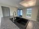 Kitchen with a large sink, granite countertop, and view to the front entryway at 12539 Dearborn Dr # A, Hudson, FL 34667