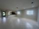 Spacious living room featuring natural light, tile floors and open layout at 12539 Dearborn Dr # A, Hudson, FL 34667