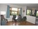 Bright and airy dining room featuring contemporary furnishings and large windows, great for Gathering gatherings at 13012 Wedgewood Way # A, Hudson, FL 34667