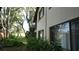 Building exterior view with lots of trees and greenery, providing a serene backdrop at 13012 Wedgewood Way # A, Hudson, FL 34667