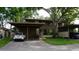 Inviting exterior with carport and well-maintained landscaping, offering curb appeal and convenient parking at 13012 Wedgewood Way # A, Hudson, FL 34667