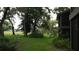 Lush green space and mature trees surrounding a residential building enhance the community's serene atmosphere at 13012 Wedgewood Way # A, Hudson, FL 34667