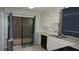 Functional kitchen featuring white cabinets and a sliding glass door, perfect for easy outdoor access at 13012 Wedgewood Way # A, Hudson, FL 34667