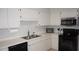 Well-lit kitchen equipped with appliances, ample counter space, and storage for culinary enthusiasts at 13012 Wedgewood Way # A, Hudson, FL 34667