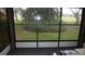 Relaxing screened porch offers a peaceful view of the backyard greenery at 13012 Wedgewood Way # A, Hudson, FL 34667
