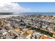 Panoramic aerial view of waterfront homes, canals, and Tampa Bay in a coastal community at 13626 Allyn Dr, Hudson, FL 34667