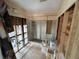 Compact bathroom area with shower and toilet awaiting renovation and customization at 13626 Allyn Dr, Hudson, FL 34667