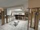 Open concept kitchen with white cabinets, skylights and tiled floors ready for renovation at 13626 Allyn Dr, Hudson, FL 34667