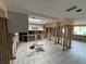 Ready for renovation kitchen with white cabinets and skylights on tiled floor at 13626 Allyn Dr, Hudson, FL 34667