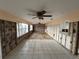Expansive living room with tile and wood flooring, offering lots of design possibilities at 13626 Allyn Dr, Hudson, FL 34667
