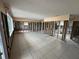Bright living room with tile floors, recessed lighting, and ample natural light at 13626 Allyn Dr, Hudson, FL 34667