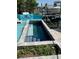 Relaxing backyard pool featuring stone accents and refreshing blue water at 13626 Allyn Dr, Hudson, FL 34667