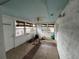 Bright sunroom features tile flooring, many windows and a ceiling fan at 13626 Allyn Dr, Hudson, FL 34667