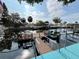 Scenic waterfront view with private docks, canals, lush vegetation, and clear blue sky at 13626 Allyn Dr, Hudson, FL 34667