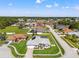 Elevated view of a beautiful home with lush green lawn and neighborhood at 13627 Lightning Rod Ct, Hudson, FL 34669