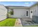 Backyard features storage shed, patio, and back door at 13627 Lightning Rod Ct, Hudson, FL 34669