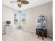 Bedroom with a fan, closet, and windows at 13627 Lightning Rod Ct, Hudson, FL 34669