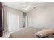 Bedroom with neutral colors, fan, and closet at 13627 Lightning Rod Ct, Hudson, FL 34669