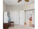Bedroom featuring fan, closet, and seating area at 13627 Lightning Rod Ct, Hudson, FL 34669