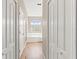 Hallway with a view of a soaking tub and a separate shower at 13627 Lightning Rod Ct, Hudson, FL 34669