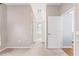 Hallway with carpeting, leading to rooms with closets on either side at 13627 Lightning Rod Ct, Hudson, FL 34669