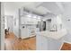 Bright kitchen with white cabinets, stainless steel appliances, and modern countertops at 13627 Lightning Rod Ct, Hudson, FL 34669