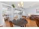Open concept kitchen, dining, and living areas with stylish decor and hardwood floors at 13627 Lightning Rod Ct, Hudson, FL 34669