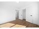 Spacious bedroom showcasing adjacent closet and ensuite bathroom access, offering comfort and convenience at 14376 Earline Rd, Brooksville, FL 34614