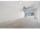 Spacious two car garage with concrete flooring and an open door showing curb view at 14376 Earline Rd, Brooksville, FL 34614