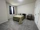 This bedroom is carpeted and features an accent chair at 1508 Figleaf Ln, Clearwater, FL 33756