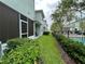 Well-maintained exterior with lush lawn and view of the community pool at 1508 Figleaf Ln, Clearwater, FL 33756