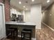Eat-in kitchen boasting granite countertops, stainless appliances, and bar stool seating at 1508 Figleaf Ln, Clearwater, FL 33756