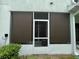 Screened-in patio with roller shade, ceiling fan, and privacy at 1508 Figleaf Ln, Clearwater, FL 33756