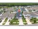 Aerial view of a home in a neighborhood with trees, highlighting location and nearby amenities at 15241 Caravan Ave, Odessa, FL 33556