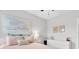 Cozy bedroom with a pink bed, neutral walls, and decorative artwork creating a peaceful retreat at 15241 Caravan Ave, Odessa, FL 33556