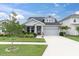 Beautiful home with a well-maintained lawn, driveway, and manicured landscaping, showcasing curb appeal at 15241 Caravan Ave, Odessa, FL 33556