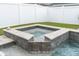Soothing hot tub with tiled accents and clean lines, offering a relaxing escape in a private backyard at 15241 Caravan Ave, Odessa, FL 33556