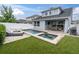 Backyard pool and spa, surrounded by a patio area, perfect for entertaining and relaxation at 15241 Caravan Ave, Odessa, FL 33556