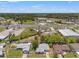 An aerial view shows the property's location near a highway and surrounding commercial and residential areas at 16018 Adobe Dr, Hudson, FL 34667