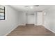 Bedroom with hardwood flooring, a ceiling fan, a closet, and neutral color walls at 16018 Adobe Dr, Hudson, FL 34667
