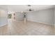 Open-concept living space with tile flooring and easy access to the backyard at 16018 Adobe Dr, Hudson, FL 34667