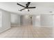 Spacious living room with tile floors and modern ceiling fan at 16018 Adobe Dr, Hudson, FL 34667