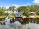 Aerial shot of lake house with private docks offering stunning views and water access for recreation at 1602 Beachway Ln, Odessa, FL 33556